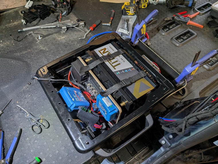 TITAN lithium battery and Victron Orion XS DC-DC charger fitted under a campervan seat by Hythe Auto Electrics