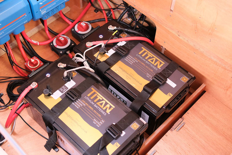 Two TITAN 460Ah lithium batteries with battery switches and Victron gear, Runa marine install by Vision Marine